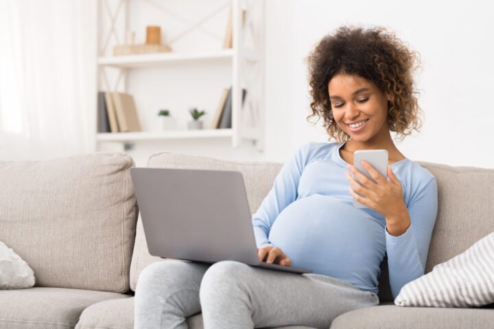 pregnant woman sitting on couch